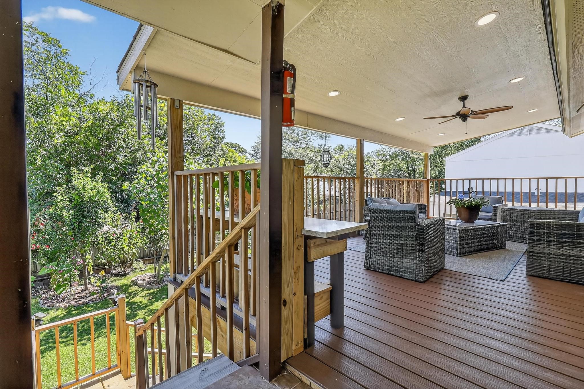 14418 Louetta Road Cypress, TX 77429 - Photo 6 of 39 a view of a chairs and table on the deck