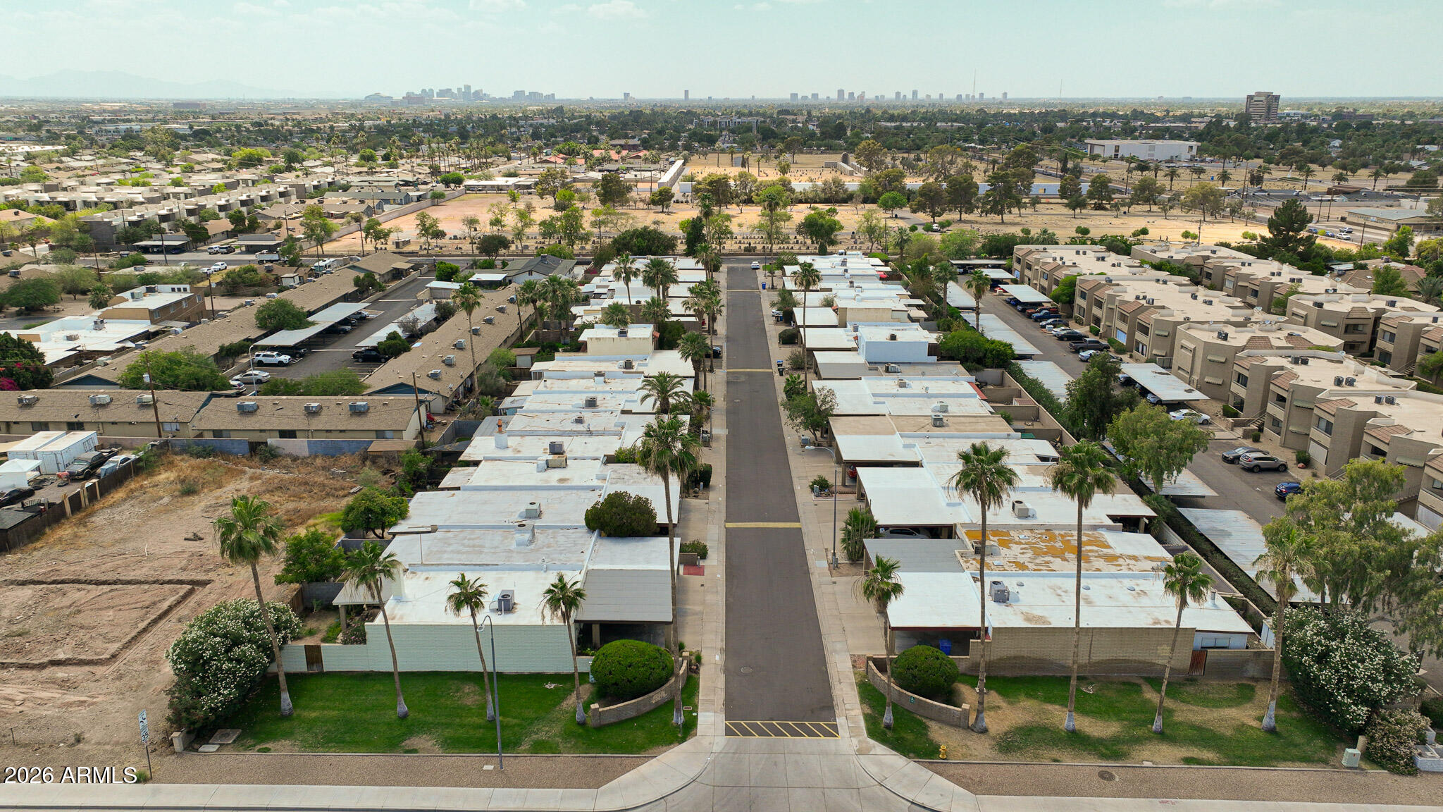 5114 East Monte Vista Road Phoenix, AZ 85008 - Photo 37 of 45 an aerial view of residential houses with outdoor space