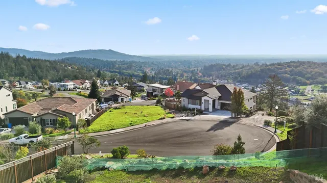 an aerial view of residential houses and outdoor space