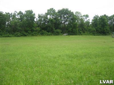 337 Henry Road Nazareth, PA 18064 - Photo 6 of 9 a view of a field with a trees in the background