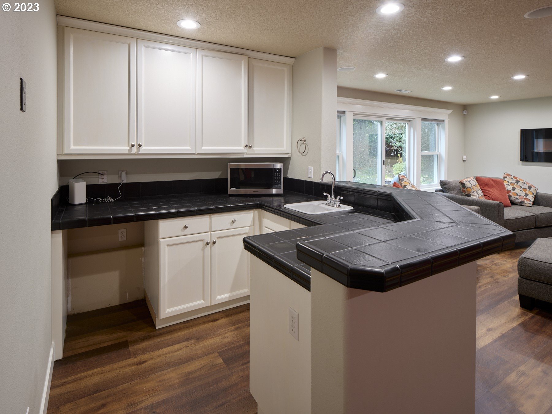 3012 Northeast 173rd Street Ridgefield, WA 98642 - Photo 29 of 32 a kitchen with granite countertop white cabinets and white appliances