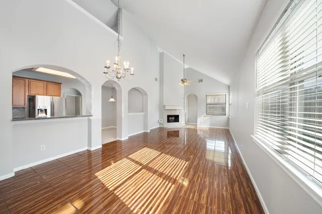 a kitchen with granite countertop wood cabinets and stainless steel appliances