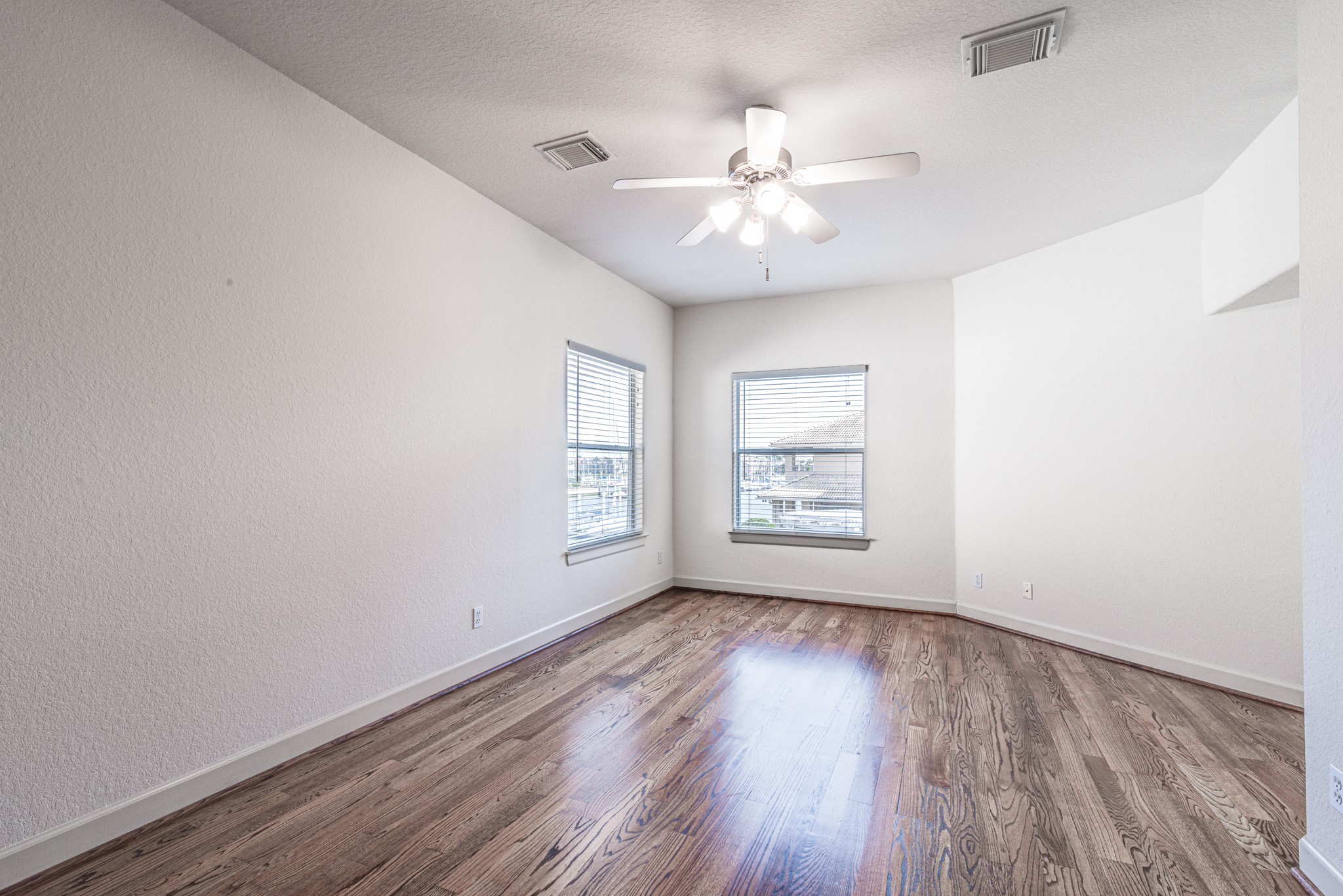 403 Harborside Way Kemah, TX 77565 - Photo 34 of 39 Third bedroom with same stunning wood floor. Enjoy views of the water.