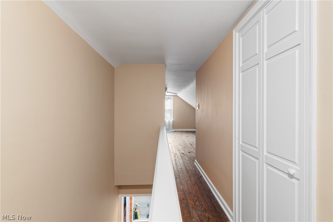 1256 Garman Road Akron, OH 44313 - Photo 21 of 32 Hallway with lofted ceiling and dark wood-type flooring