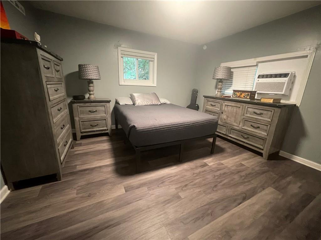 500 7th Avenue Freedom, PA 15042 - Photo 11 of 21 a bedroom with a bed and a refrigerator
