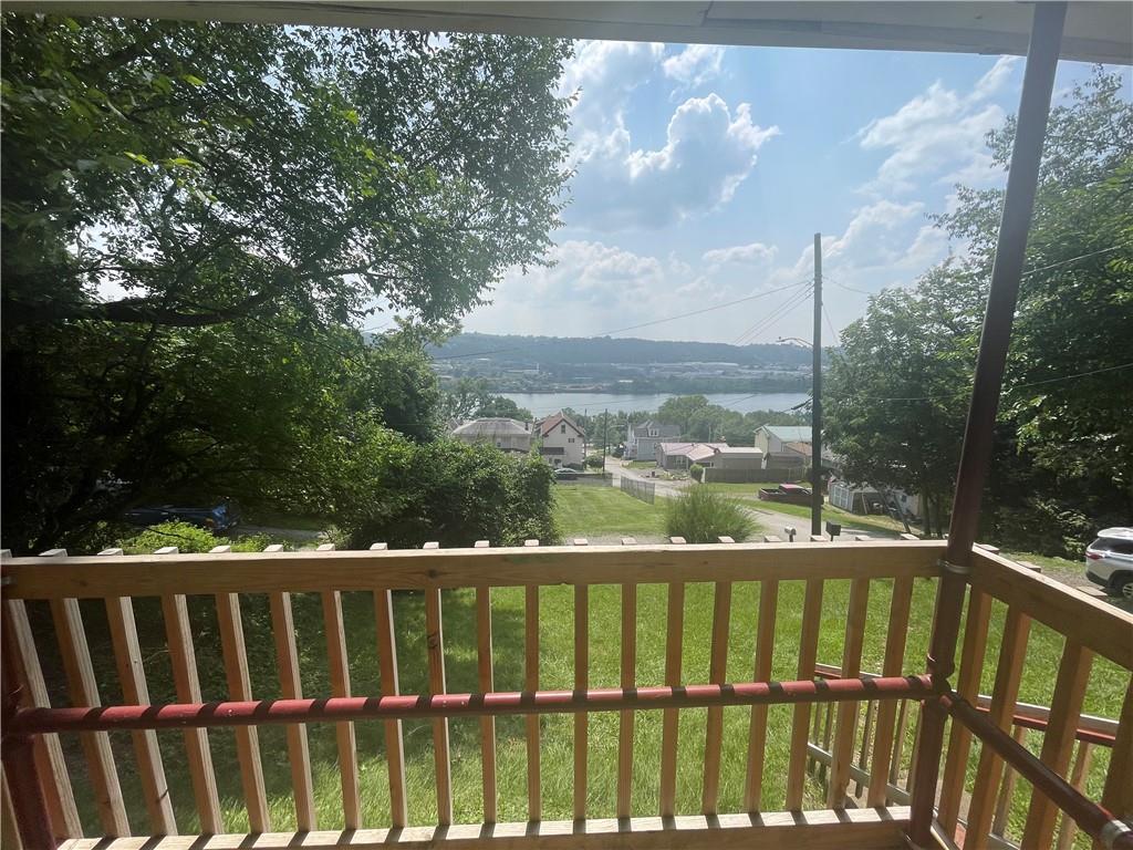 500 7th Avenue Freedom, PA 15042 - Photo 3 of 21 a view of a balcony with wooden fence