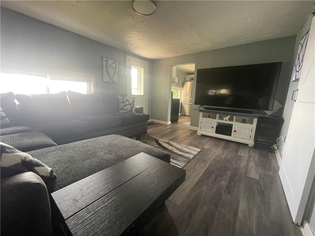 500 7th Avenue Freedom, PA 15042 - Photo 7 of 21 a living room with furniture and a flat screen tv
