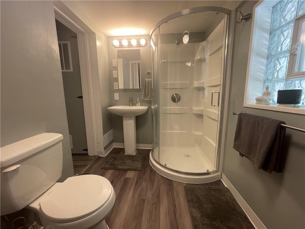 500 7th Avenue Freedom, PA 15042 - Photo 8 of 21 a bathroom with a sink a toilet a mirror and shower