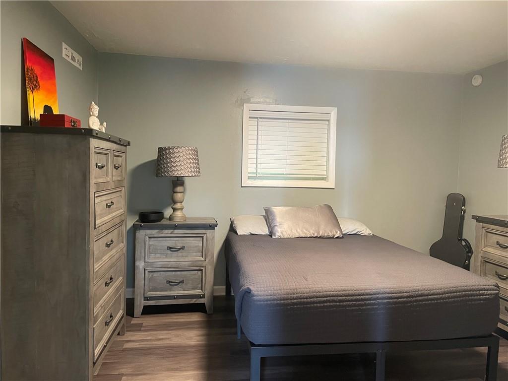 500 7th Avenue Freedom, PA 15042 - Photo 9 of 21 a bedroom with a bed and a flat tv screen