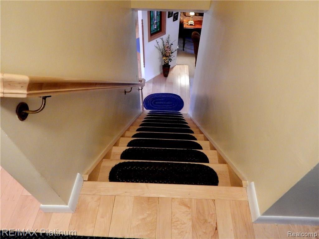 86 South Burkhart Road Howell, MI 48843 - Photo 28 of 52 Gorgeous Maple Hardwood Floor goes thru Kitchen, Dining Area and up the stairs into the Bedroom Hallway.