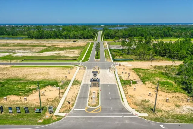 a view of a swimming pool with a yard