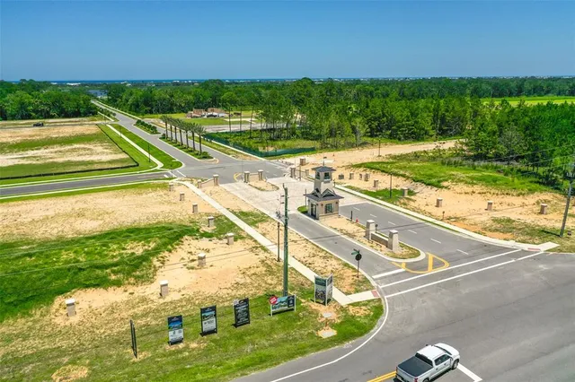 a view of a swimming pool with a yard