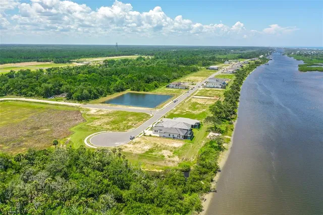 a view of a swimming pool with a yard