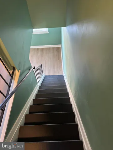 a view of room with window and ceiling fan