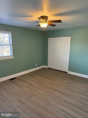 a bathroom with a shower a toilet and a sink
