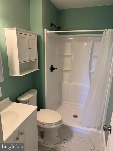 a view of front door with wooden floor
