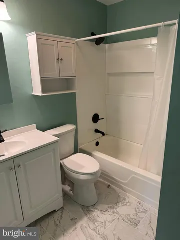 an empty room with wooden floor and closet