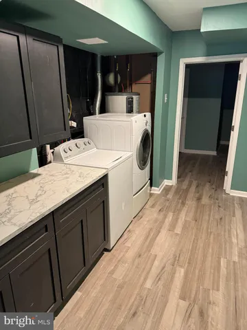 an empty room with wooden floor and closet