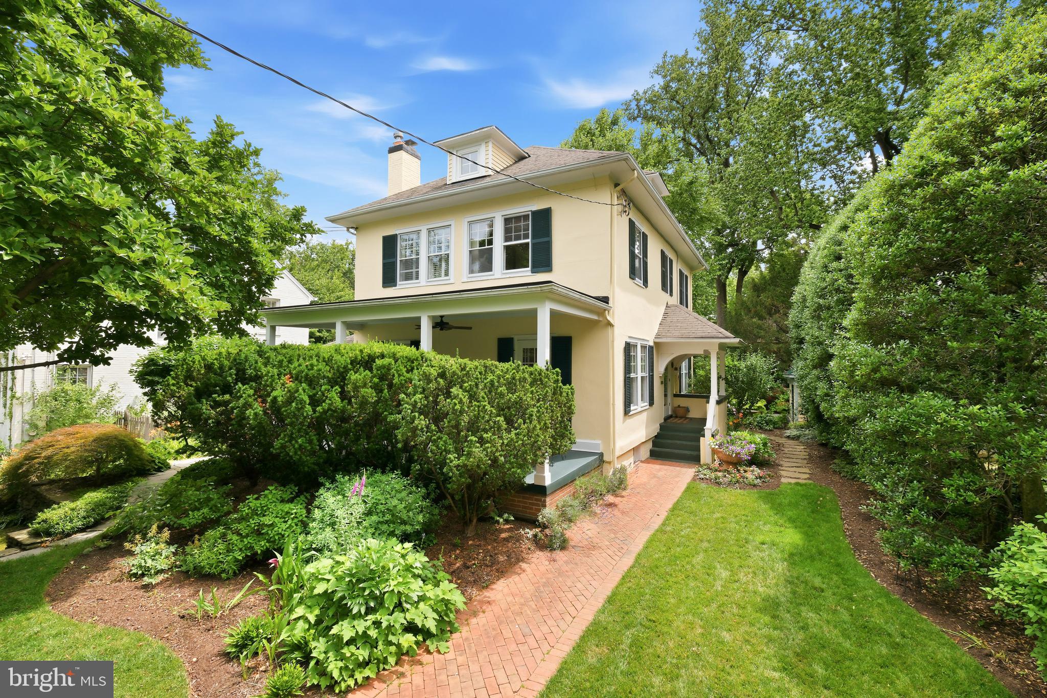 6411 33rd Street Northwest Washington, DC 20015 - Photo 1 of 48 a front view of a house with a yard