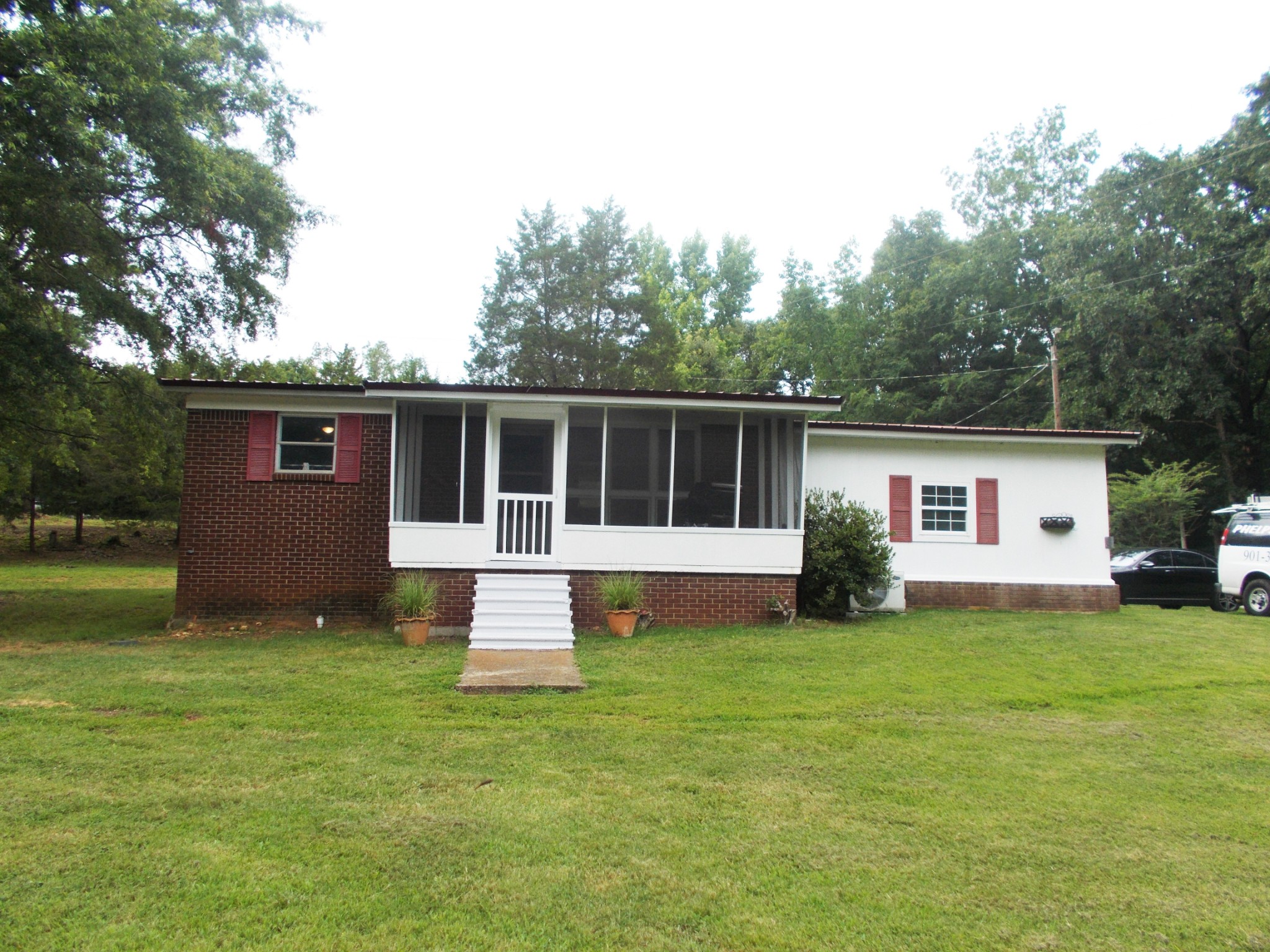 979 Highlander Road Camden, TN 38320 - Photo 1 of 23 a view of a house with a yard