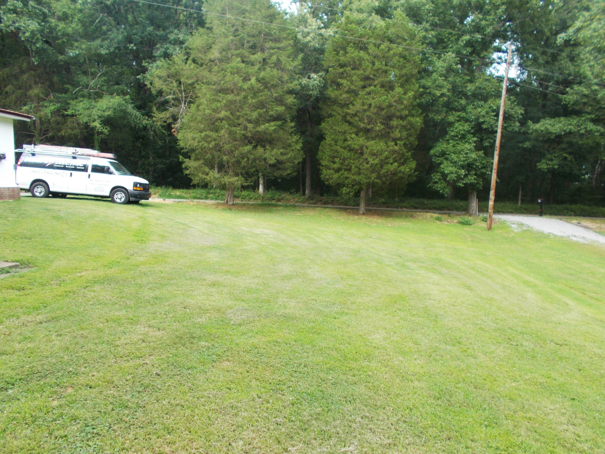 979 Highlander Road Camden, TN 38320 - Photo 11 of 23 a view of a car parked in the yard