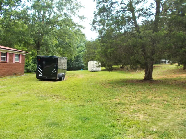 a view of a lake with a yard