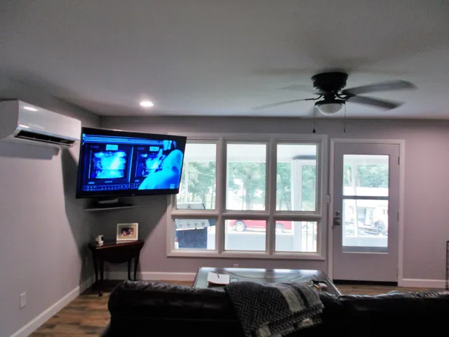 a living room with furniture and a flat screen tv