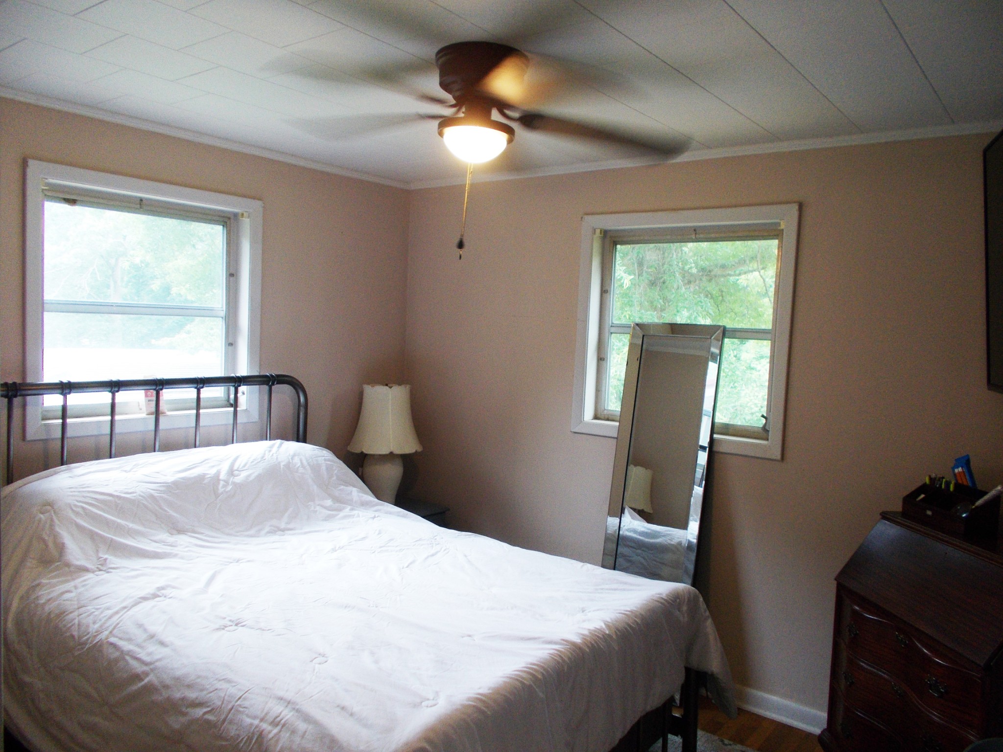 979 Highlander Road Camden, TN 38320 - Photo 6 of 23 a bedroom with a bed and a chandelier