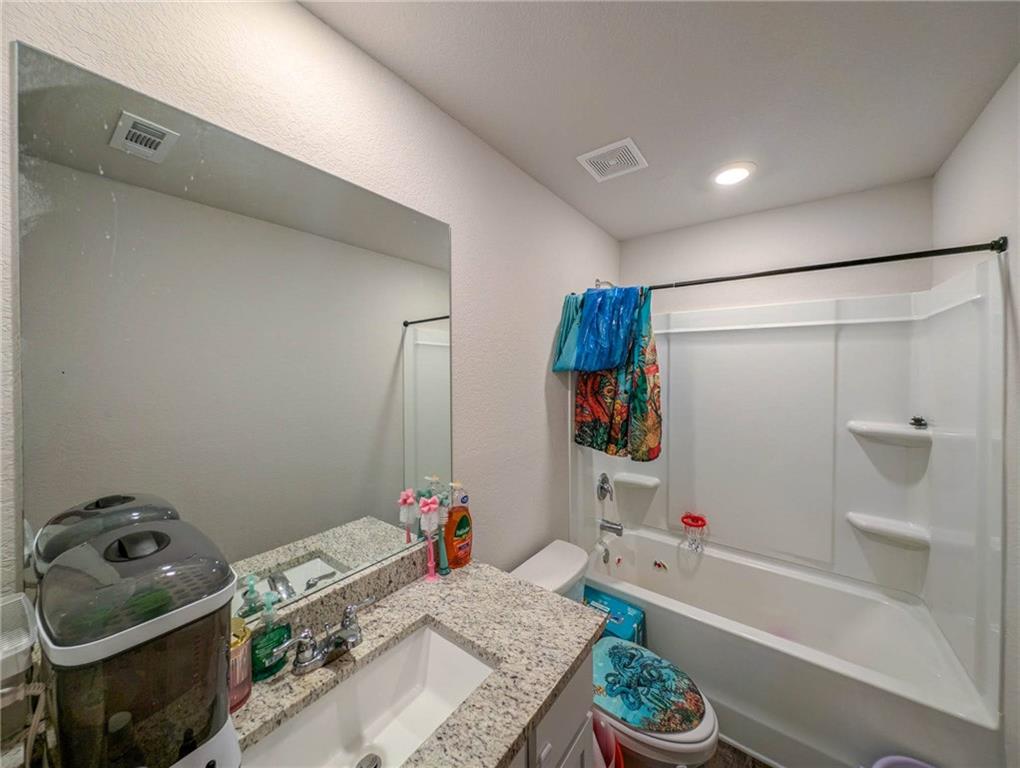 635 Meadows Farm Way Monroe, GA 30655 - Photo 32 of 36 a bathroom with a bathtub sink and shower