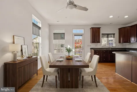 a dining room with furniture and window