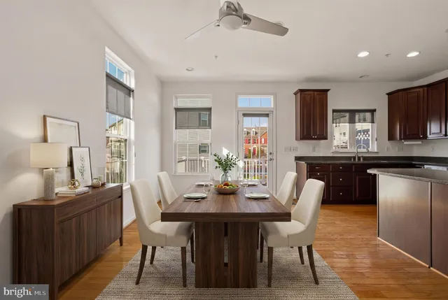a dining room with furniture and window