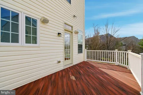 a porch with a wooden floor