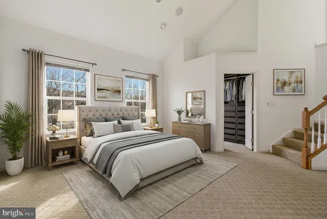 a bedroom with a bed and a couch