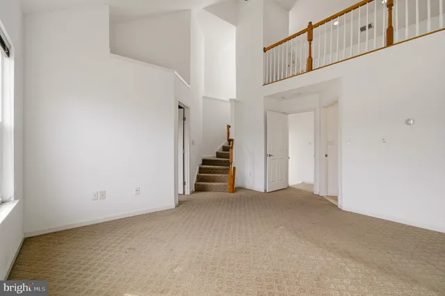 a view of a hallway with stairs