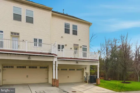 a view of a house with a yard and garage