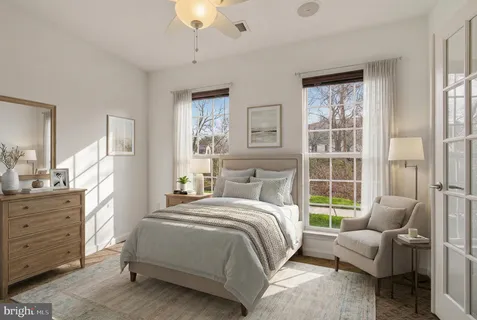 a bedroom with a bed and a couch