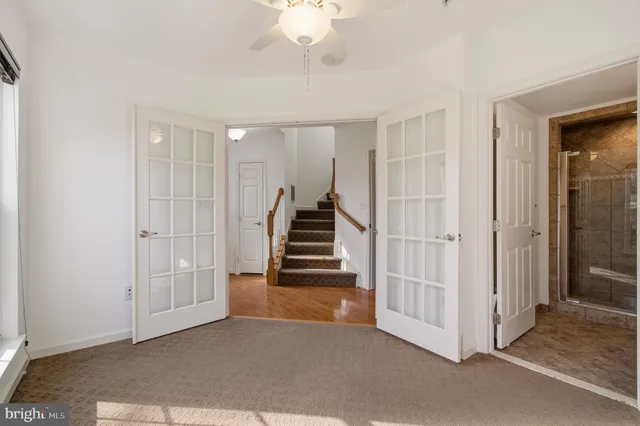 a view of a livingroom with stairs and ventilation