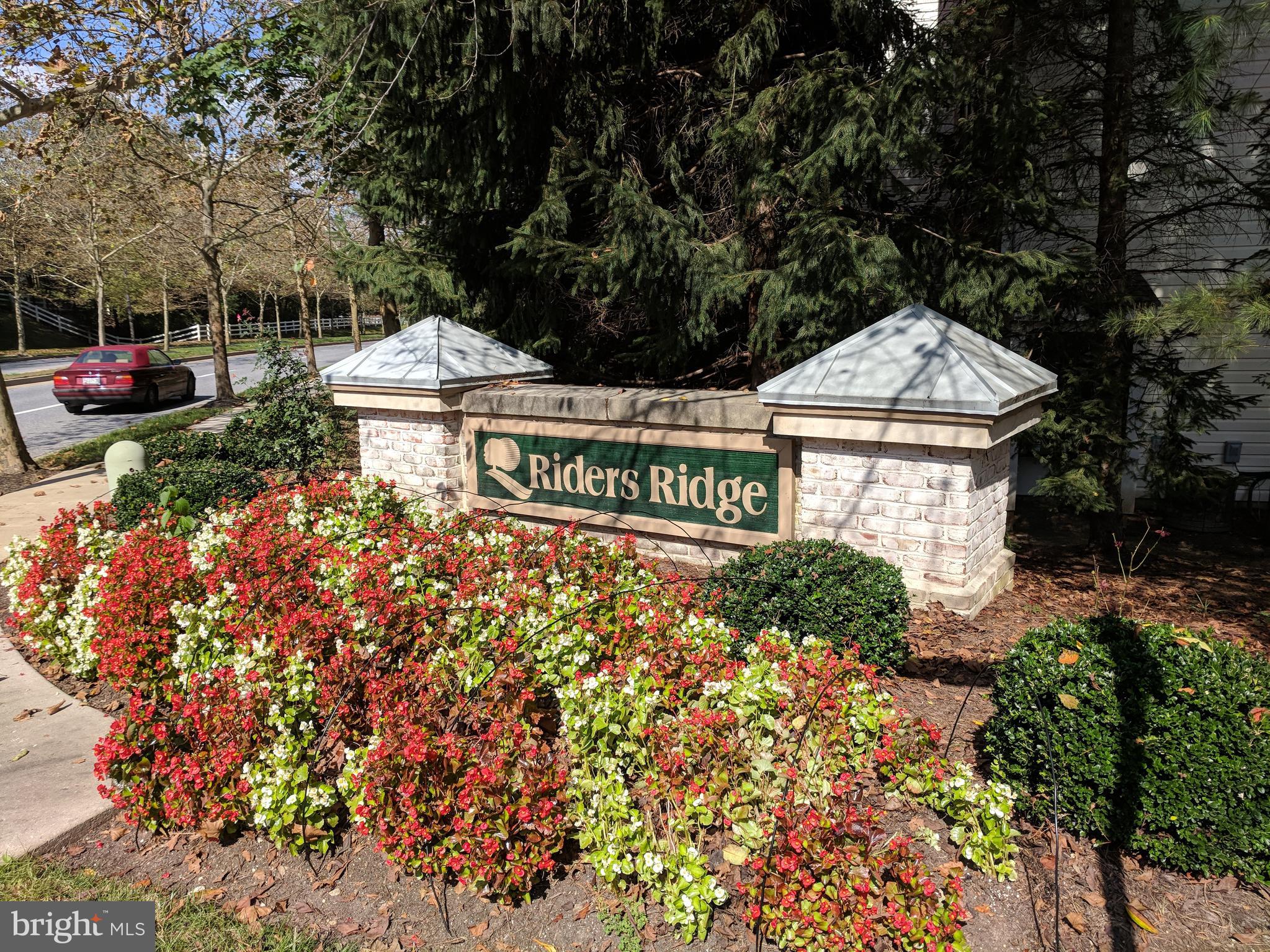 4862 Shellbark Road, Unit F Owings Mills, MD 21117 - Photo 2 of 20 a view of a sign board with street and trees