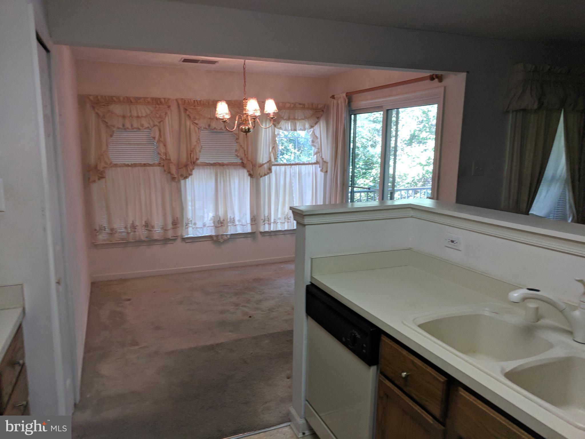 4862 Shellbark Road, Unit F Owings Mills, MD 21117 - Photo 13 of 20 a bathroom with a sink and a mirror