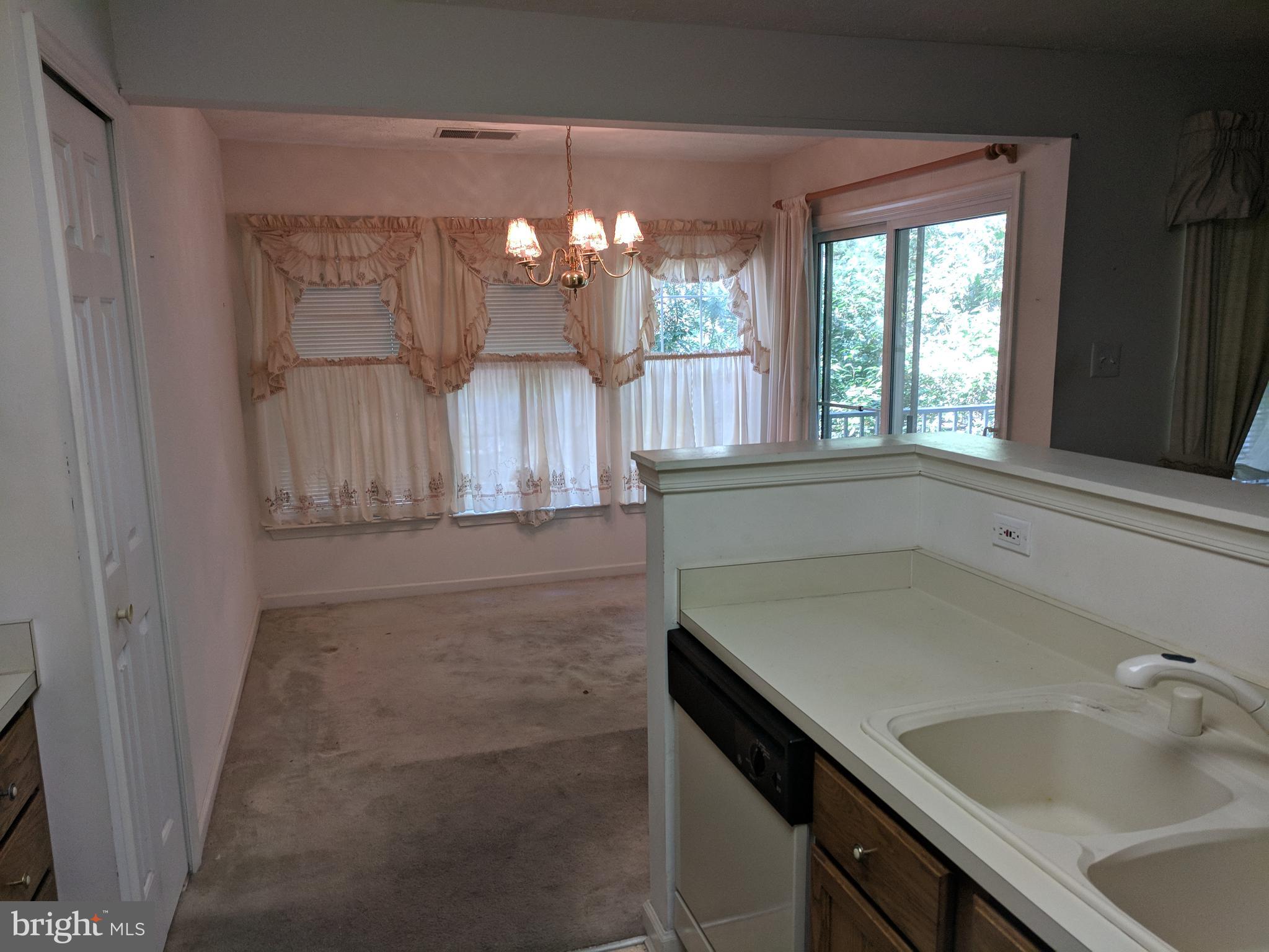 4862 Shellbark Road, Unit F Owings Mills, MD 21117 - Photo 14 of 20 a bathroom with a sink and a mirror