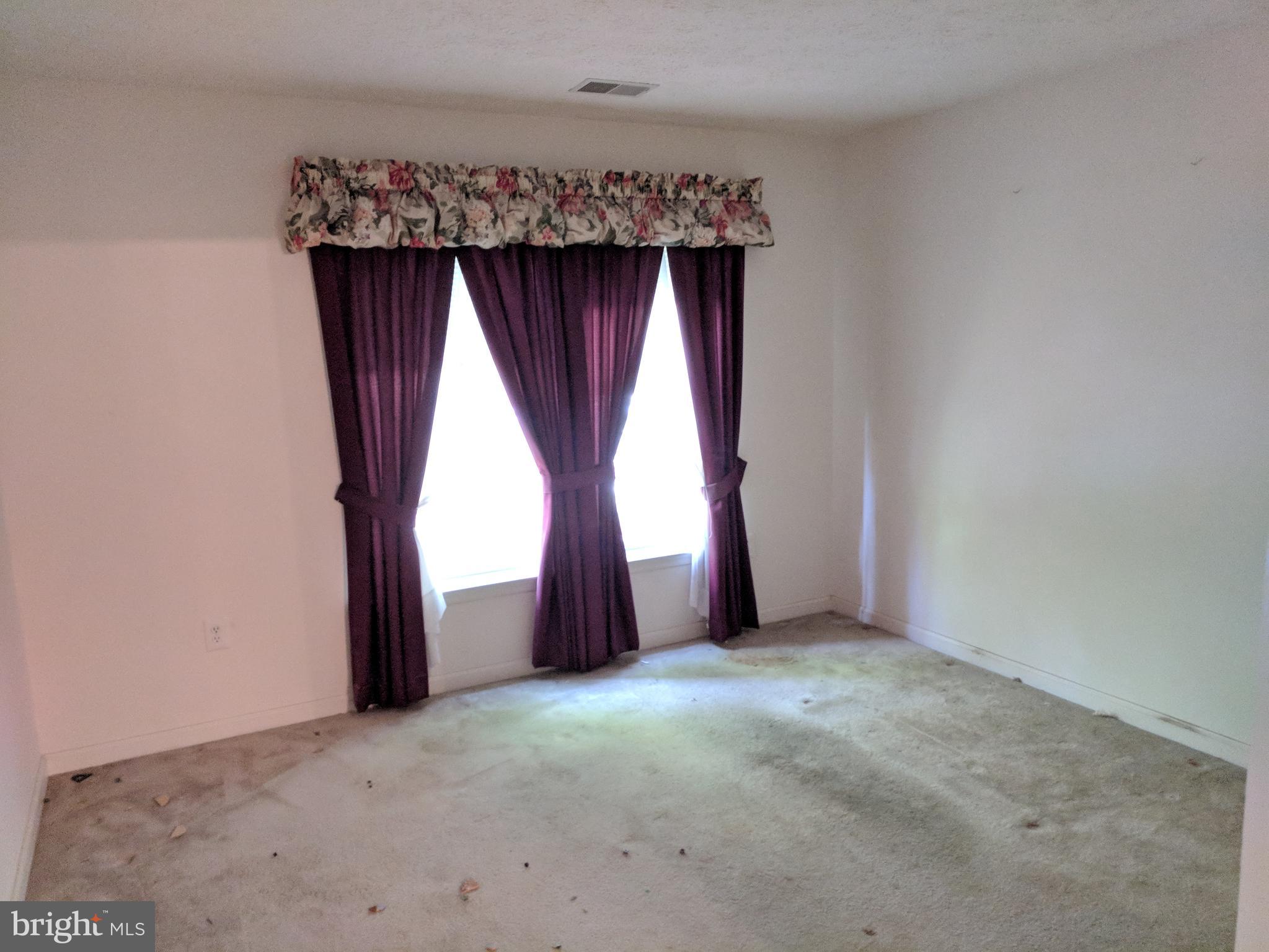 4862 Shellbark Road, Unit F Owings Mills, MD 21117 - Photo 18 of 20 an empty room with windows and closet