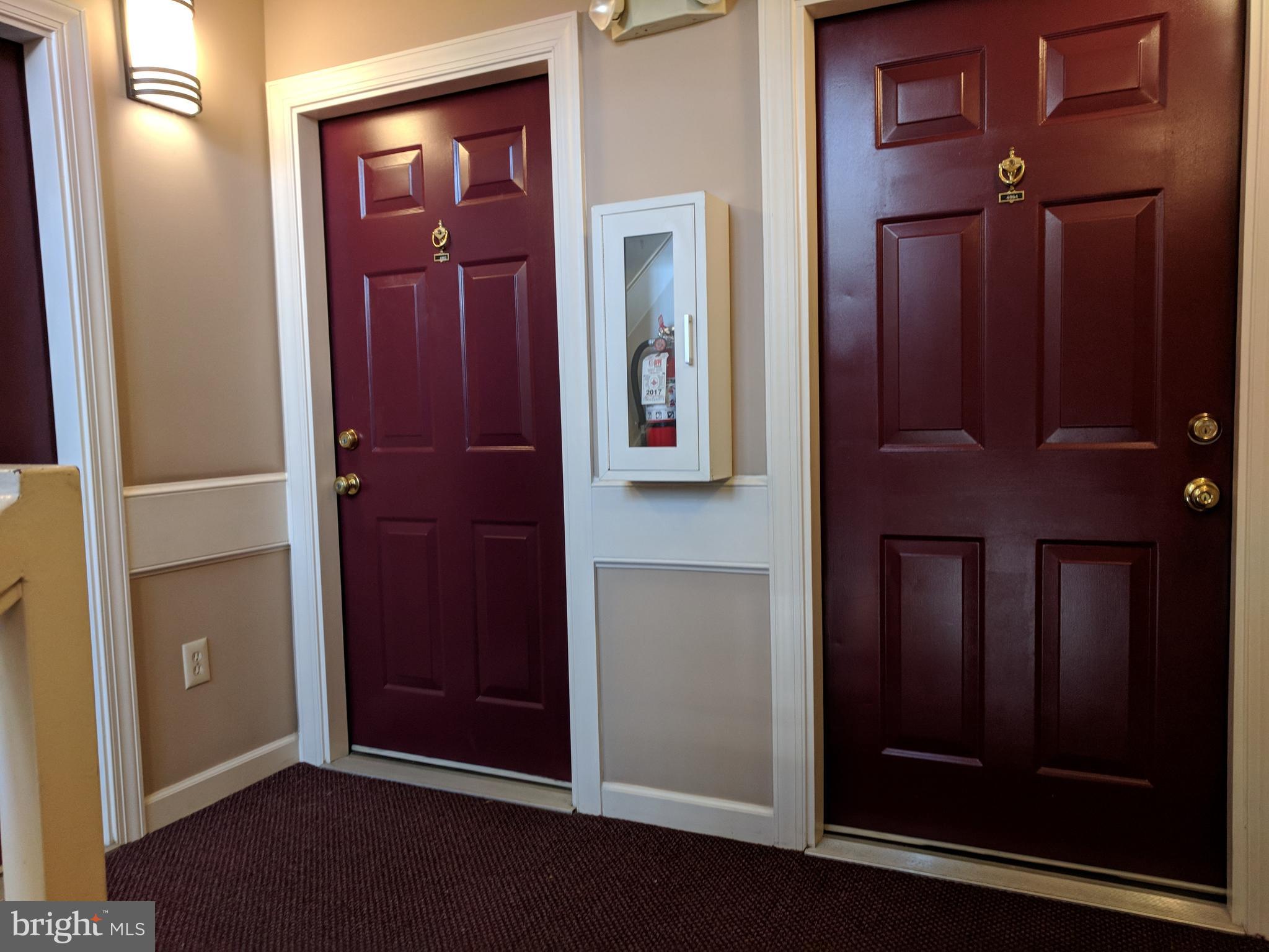 4862 Shellbark Road, Unit F Owings Mills, MD 21117 - Photo 4 of 20 an entryway with a mirror
