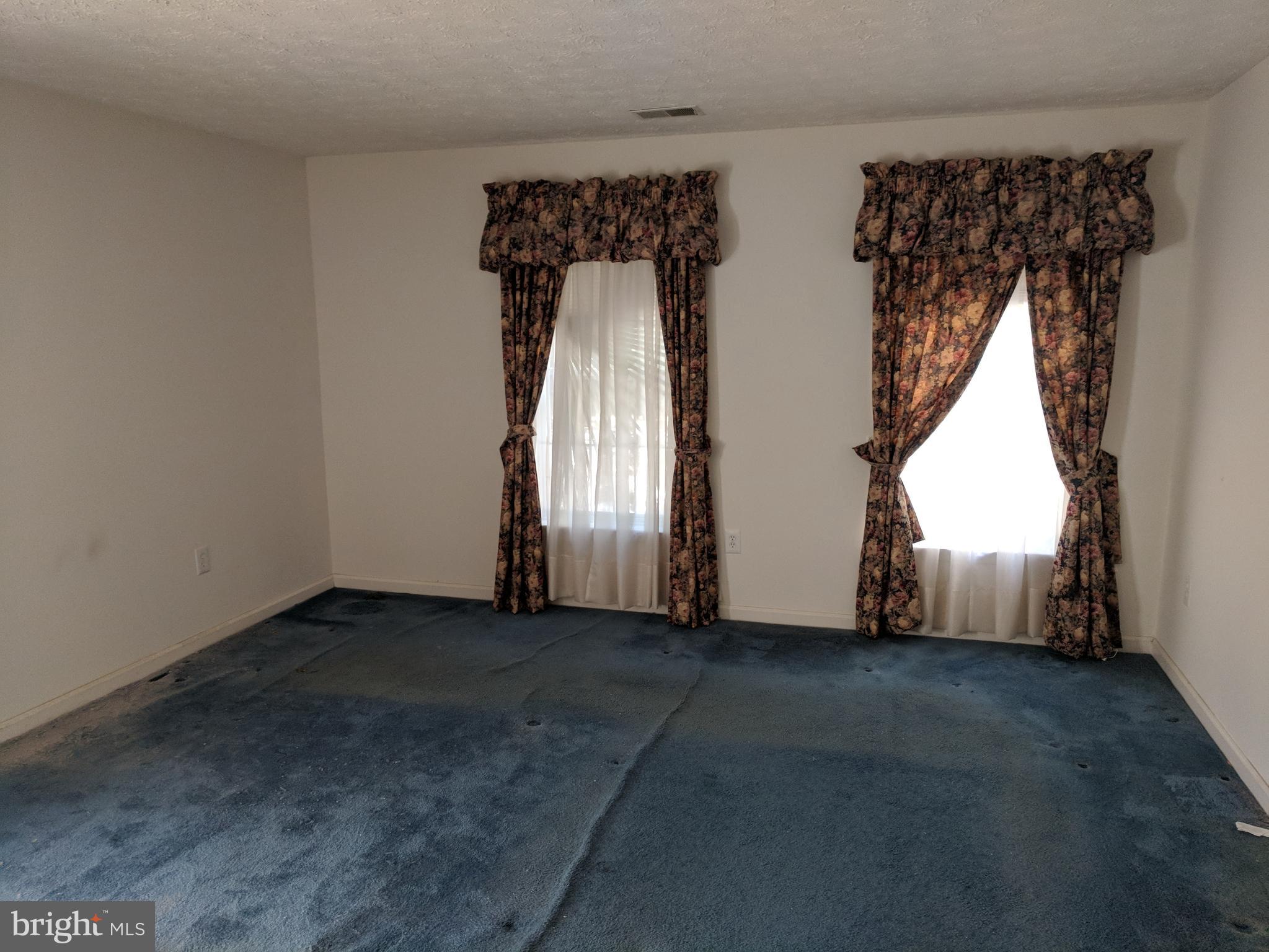 4862 Shellbark Road, Unit F Owings Mills, MD 21117 - Photo 9 of 20 an empty room with windows