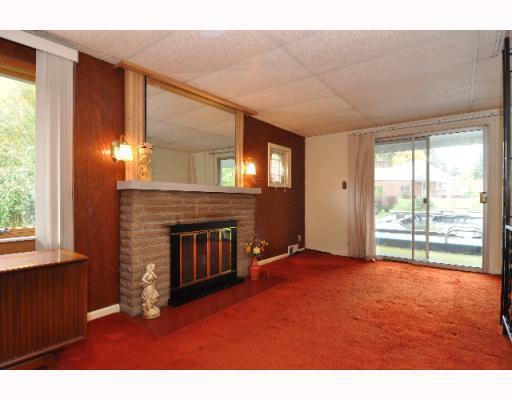 498 Chapel Road Aliquippa, PA 15001 - Photo 11 of 18 Living Room. Working Fire place. View onto the inground pool