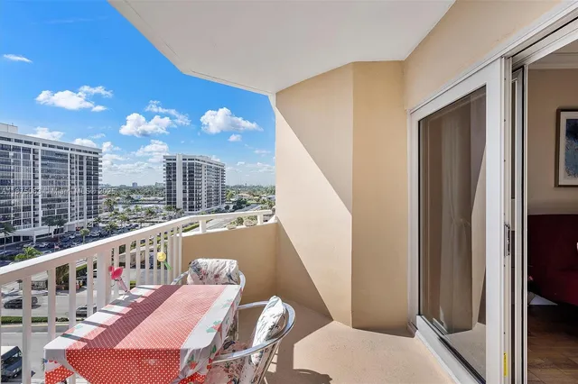 a view of balcony with furniture