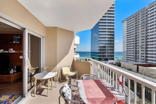 a view of balcony with wooden floor