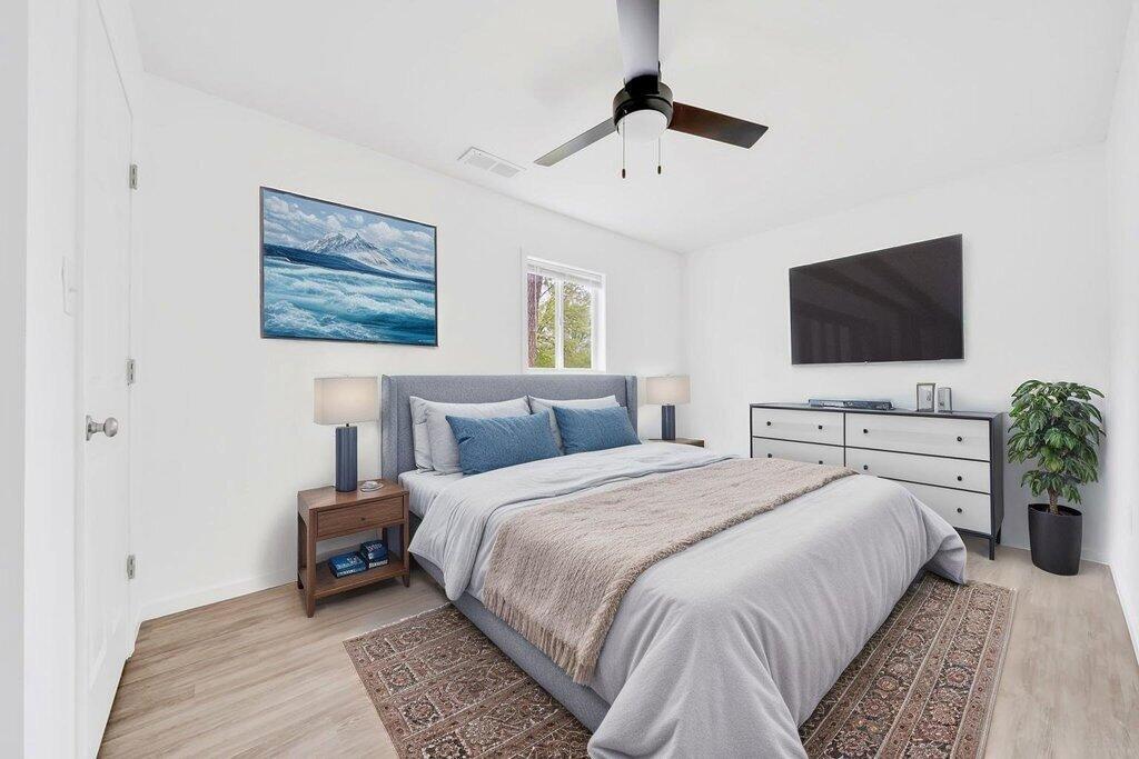 5247 West 3rd Avenue Gary, IN 46406 - Photo 13 of 16 a bedroom with a bed and a flat screen tv