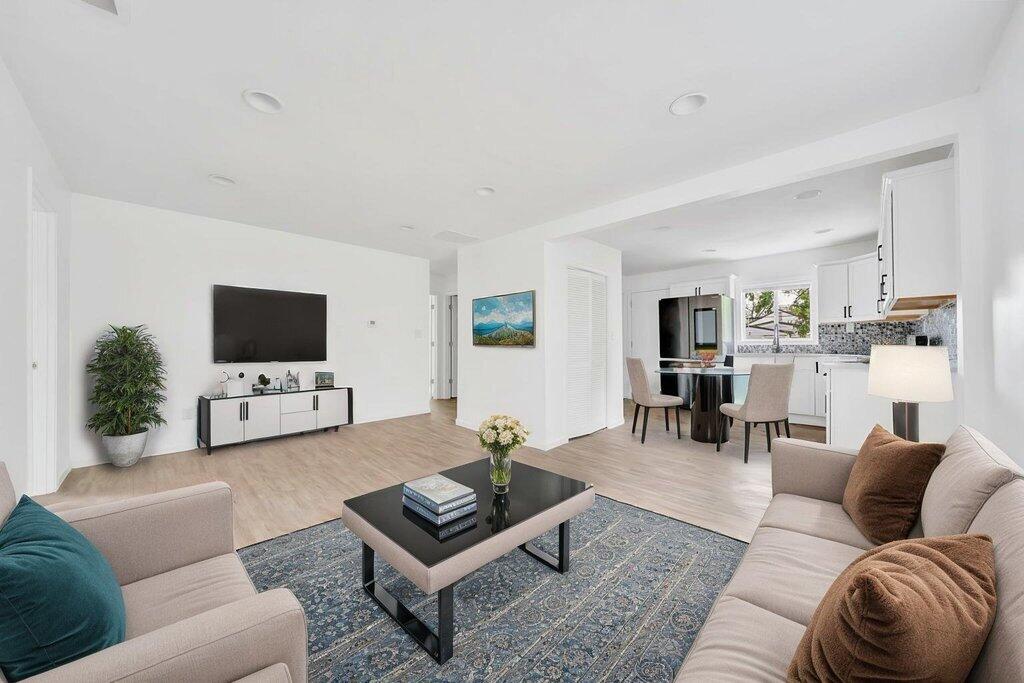5247 West 3rd Avenue Gary, IN 46406 - Photo 3 of 16 a living room with furniture and a flat screen tv
