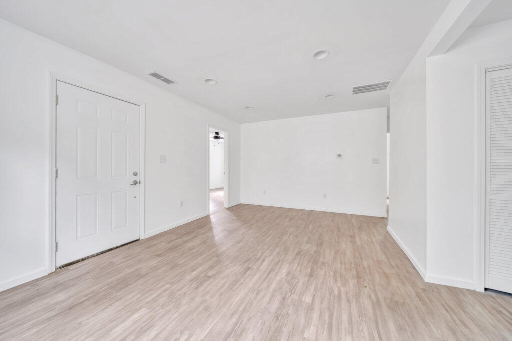 5247 West 3rd Avenue Gary, IN 46406 - Photo 4 of 16 a view of an empty room with wooden floor