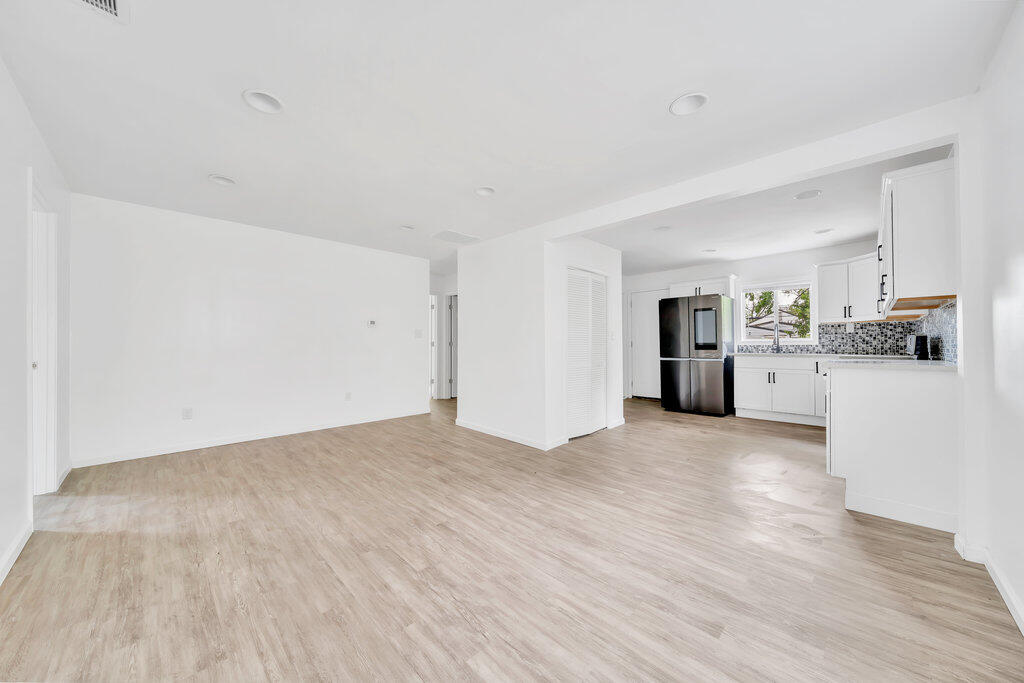 5247 West 3rd Avenue Gary, IN 46406 - Photo 8 of 16 a view of a kitchen with a sink and a stove top oven